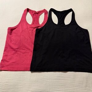 Two lululemon Swiftly Tech Racerback Tank Tops - one Raspberry and one Black